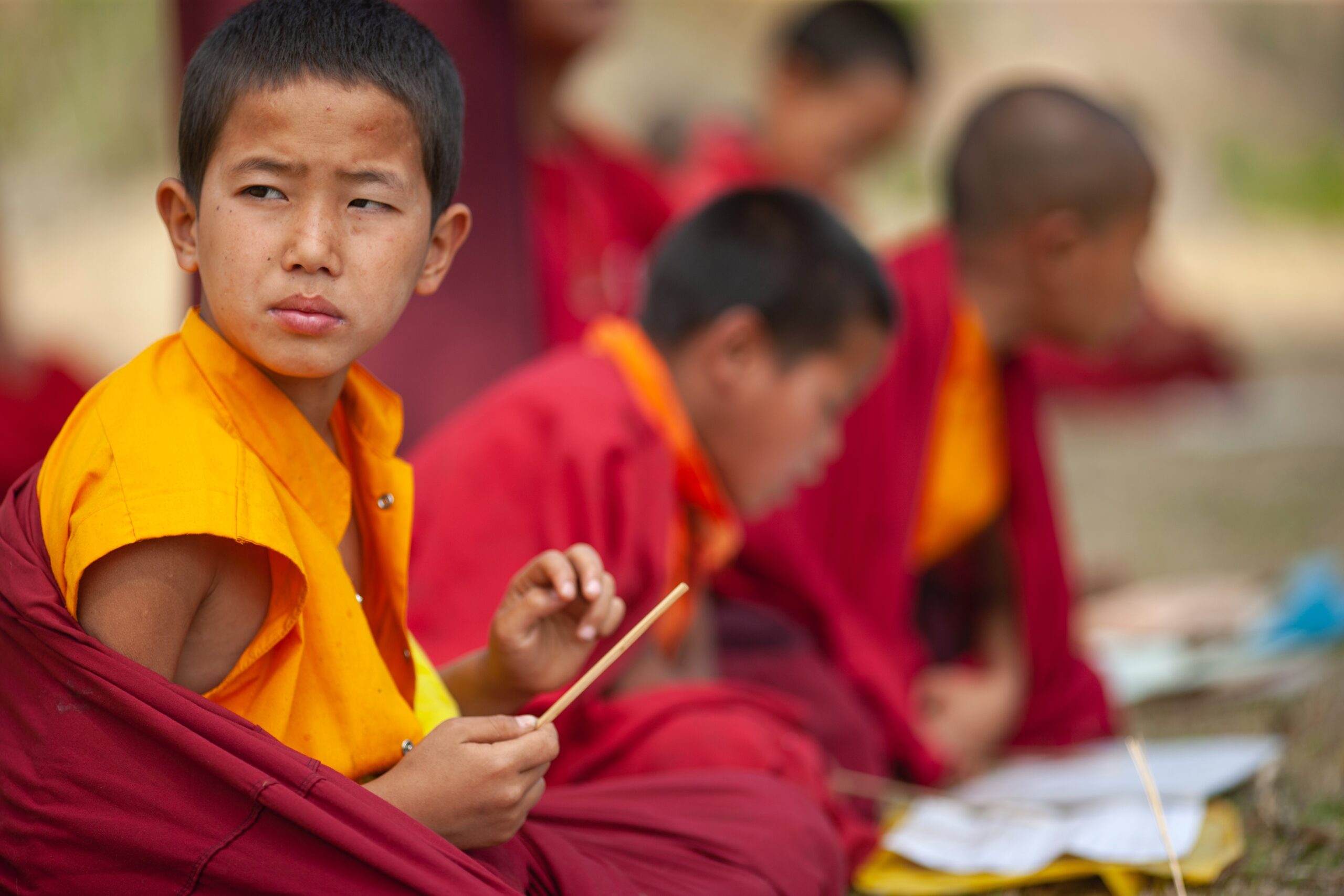 Digambara Monks, selective focus photography of boy sitting in round