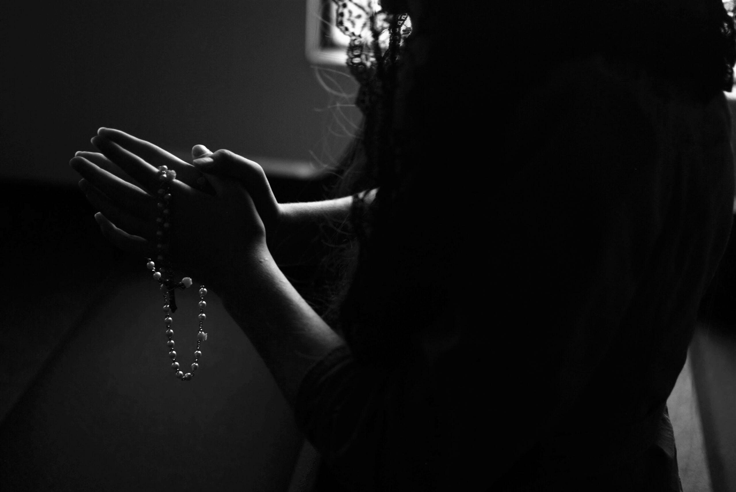 Sanatan Religion, silhouette of woman holding rosary while praying