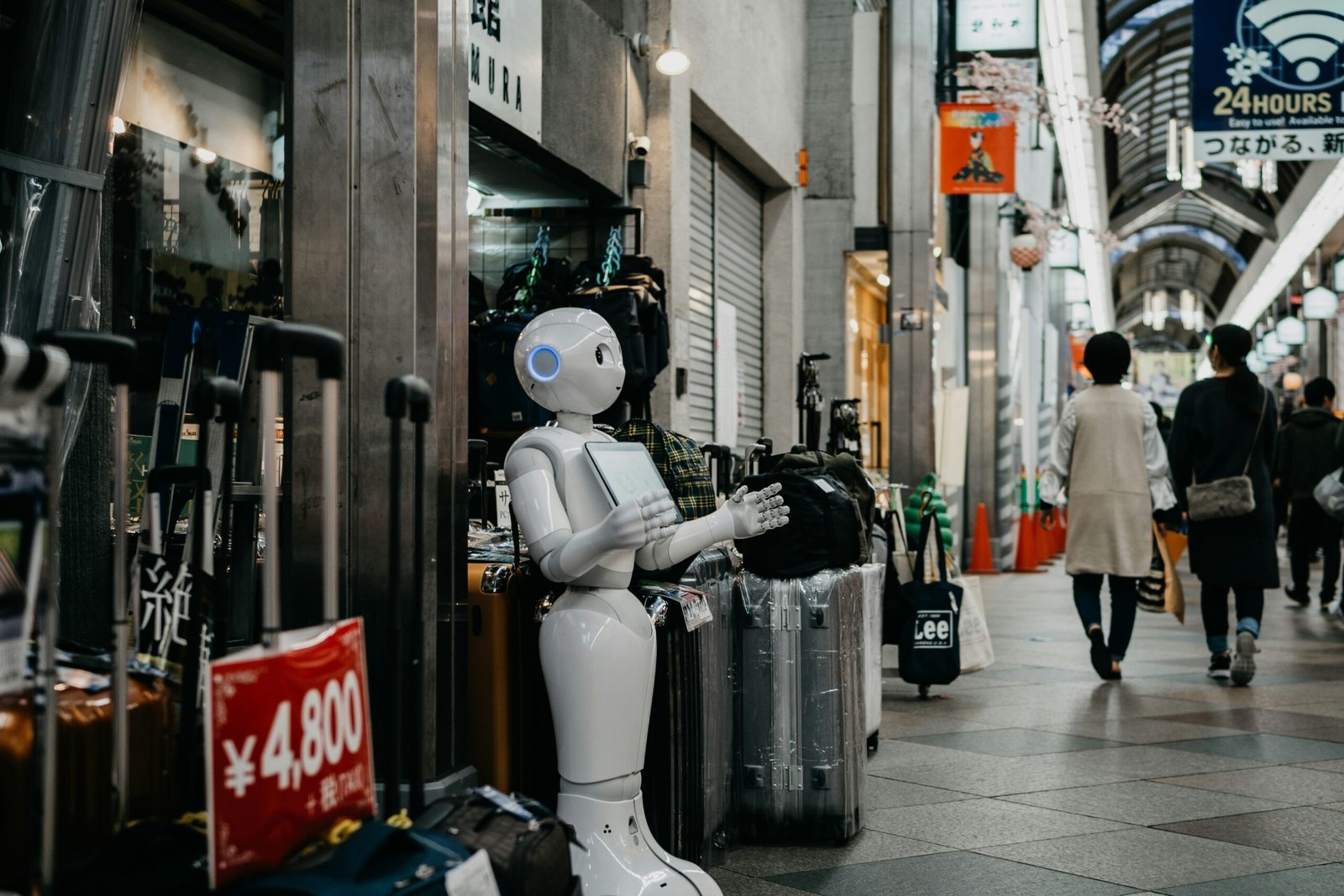 Impact of AI, robot standing near luggage bags