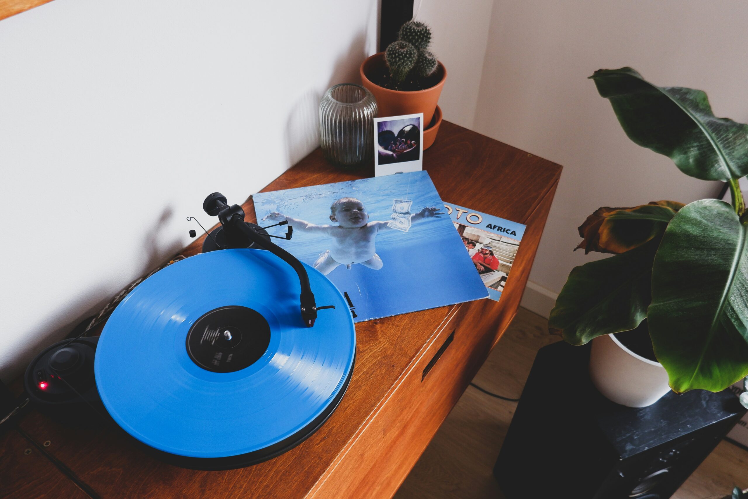 Nirvana in Buddhism, blue vinyl record on brown wooden table