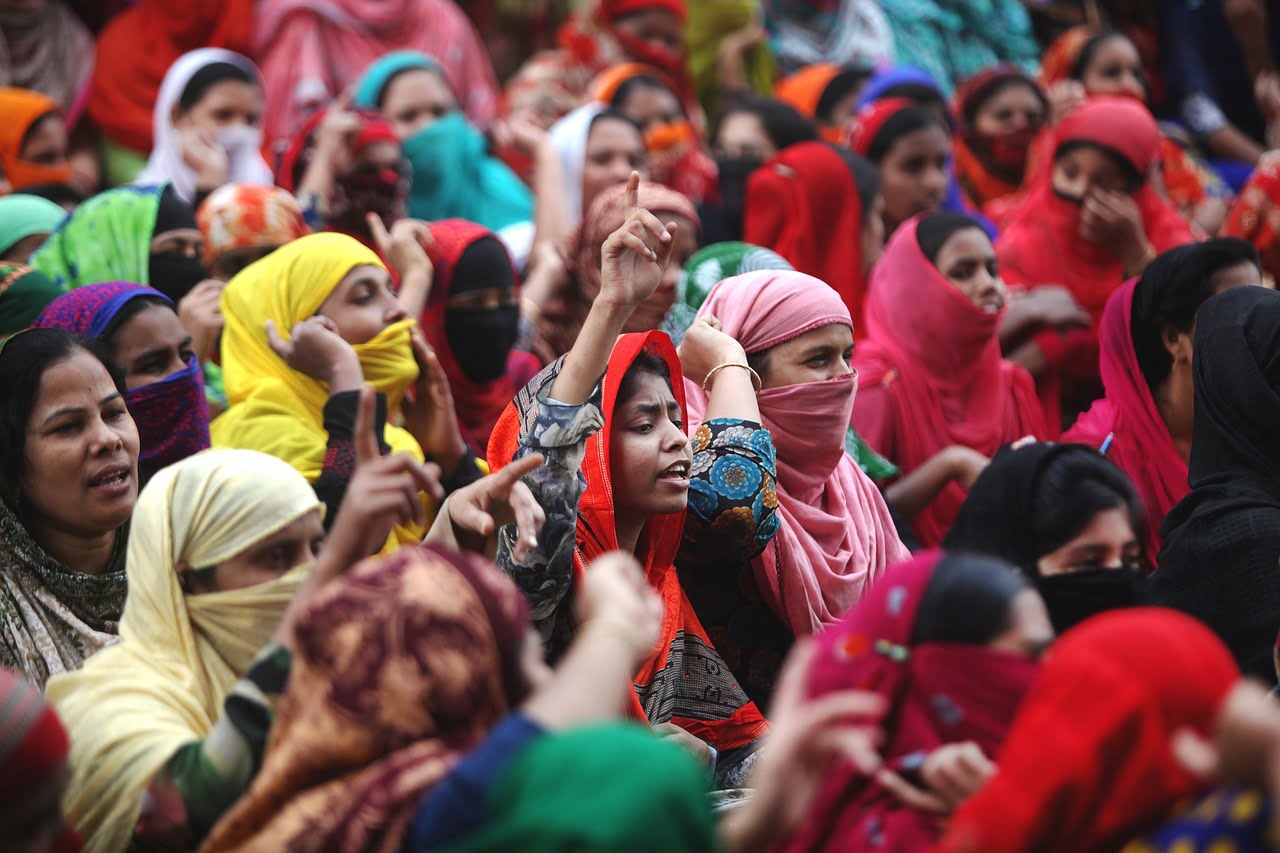 crowd of women wearing colorful headscarves